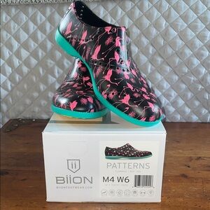 Black and Pink Athletic Shoes with Camouflage Design